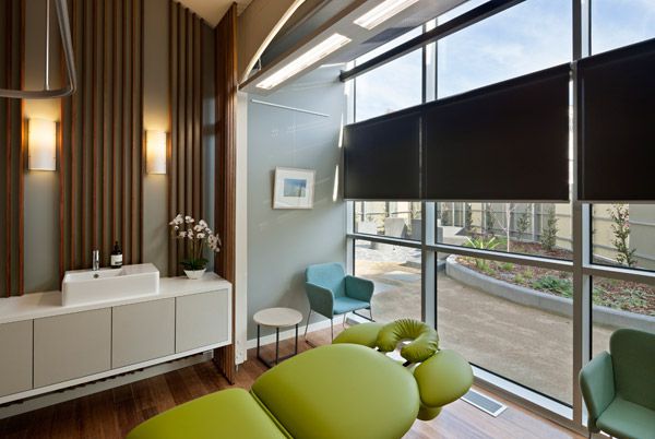 Patient lounge overlooking the wellness garden and sun-terrace. Natural light, finishes,colours and textures create a sense of bringing the outdoors inside. 
